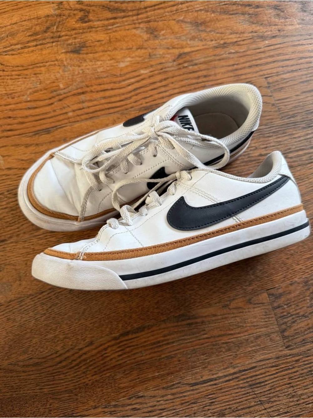 Nike White Sneakers with Black Swoosh and Tan Accent